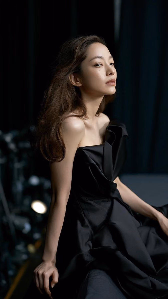 A visually young and elegant woman, skin firm and luminous w