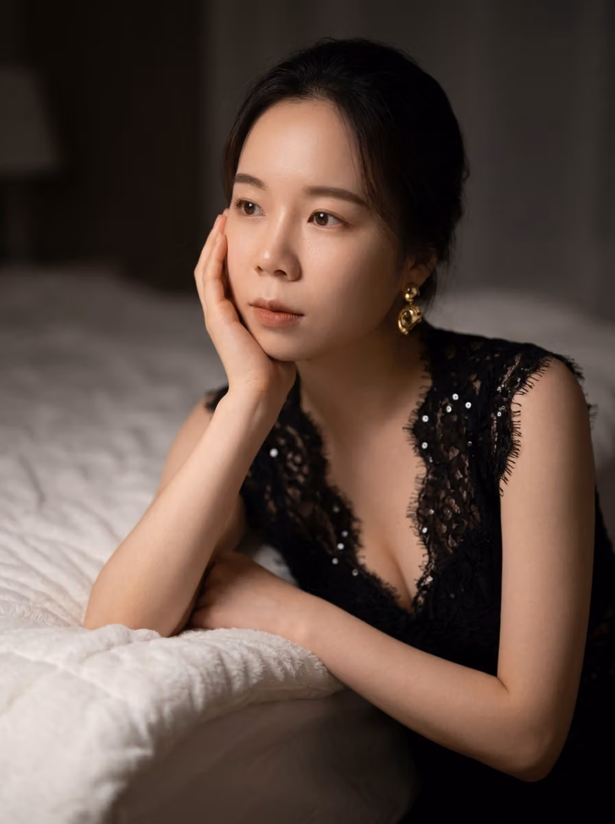 Elegant East Asian Woman in Lace Top, Moody Bedroom