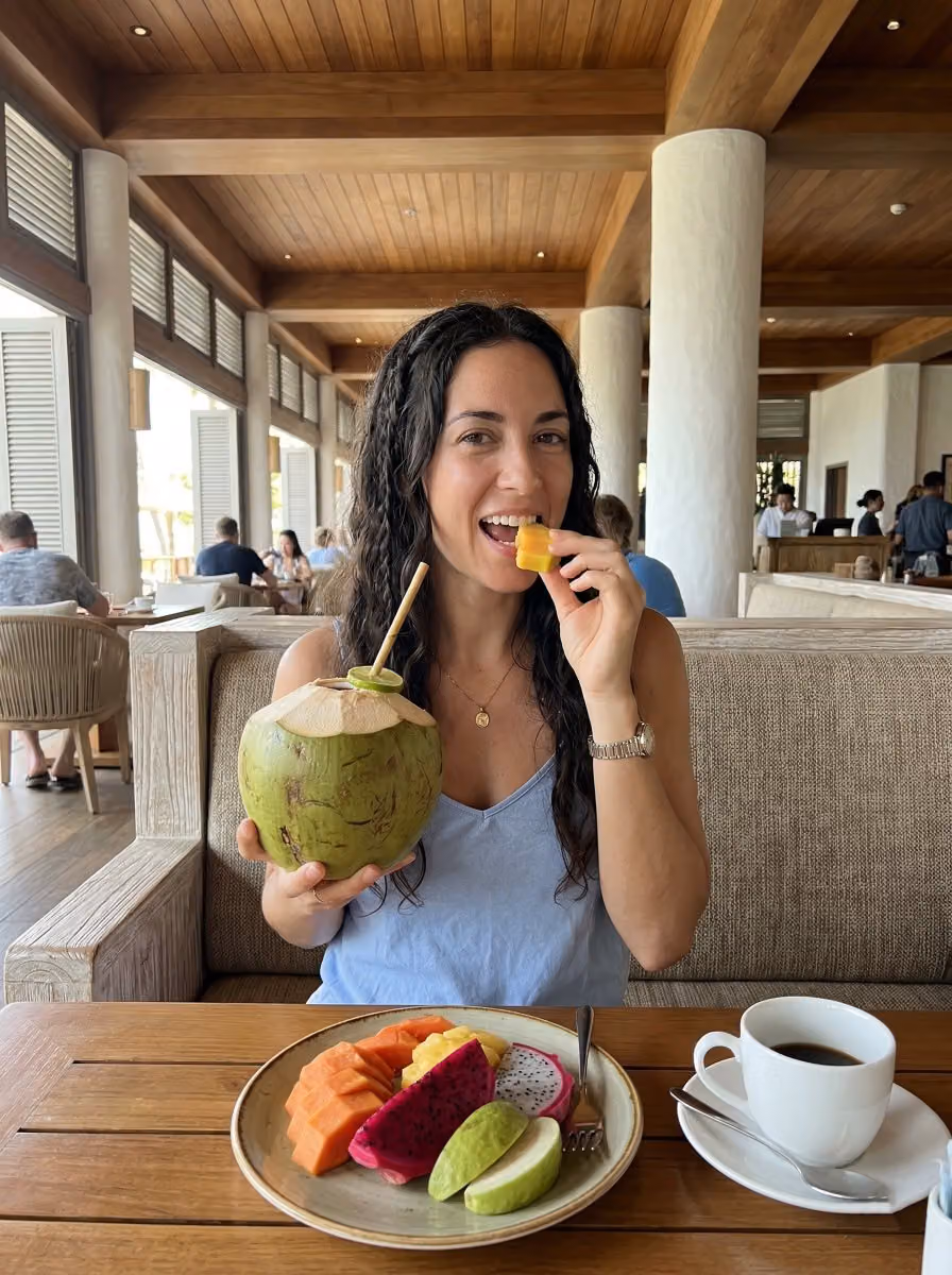 Woman at Resort Restaurant with Tropical Fruit