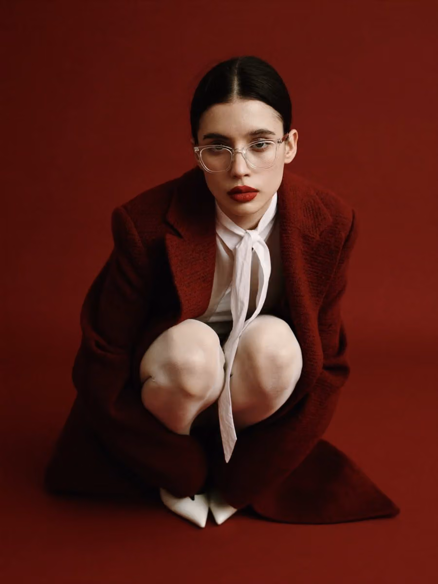 High-Fashion Portrait with Red Coat and Bow Tie