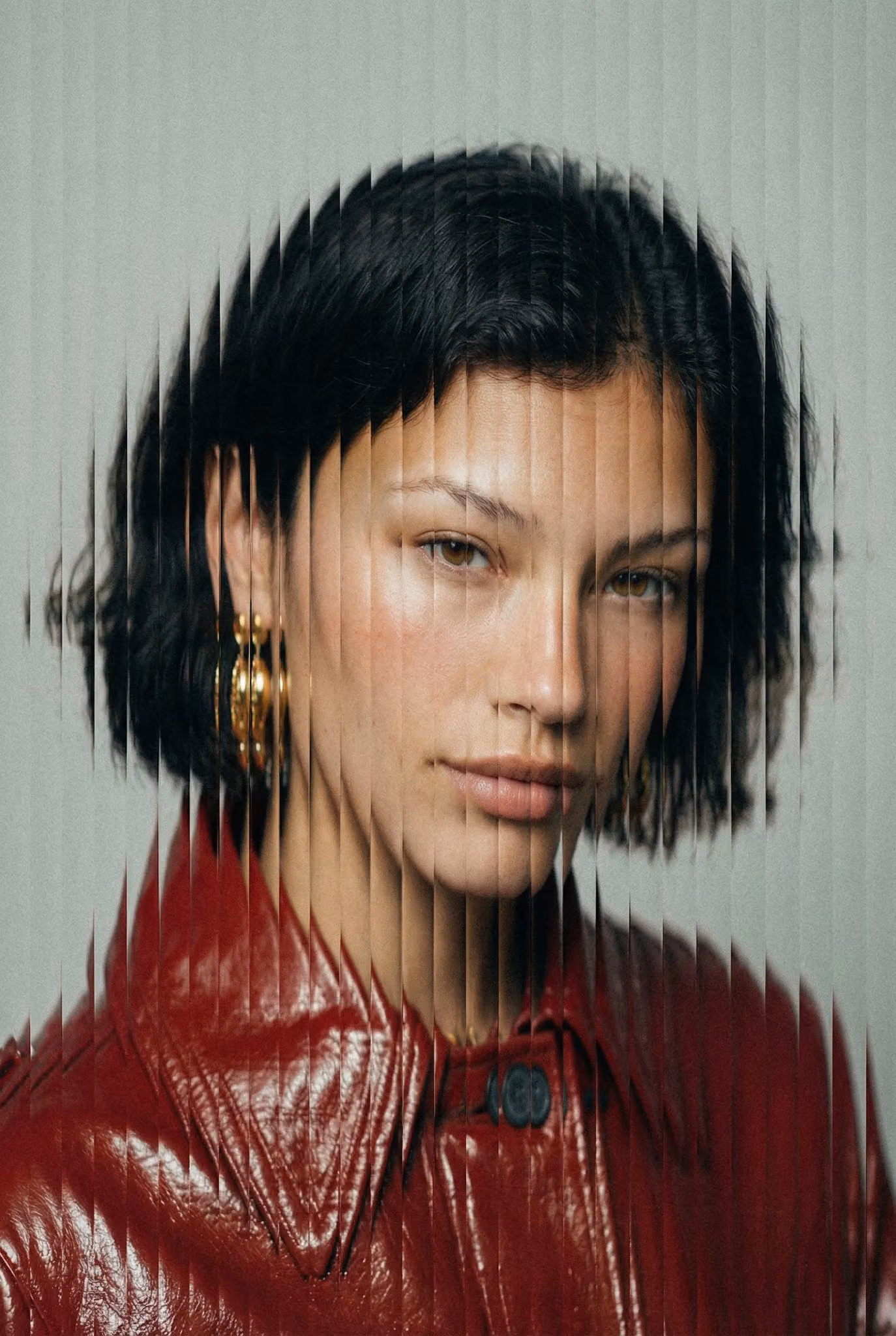 High-fashion portrait with vertical slice distortion, glitch splitting, and analog-style grain